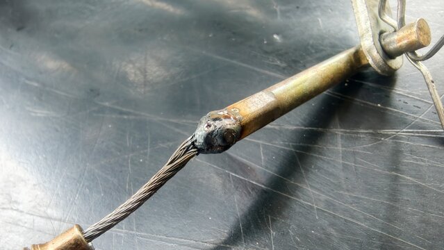 The soldered brake cable is positioned, connected, or joined using solder.