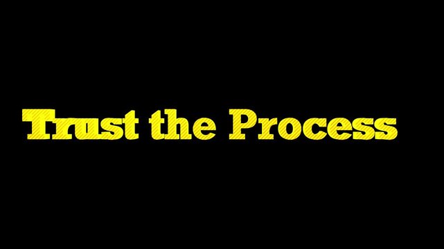 Statement showcasing trust the process formed by chunky yellow characters standing out prominently against a deep solid black background delivering clear guidance.
