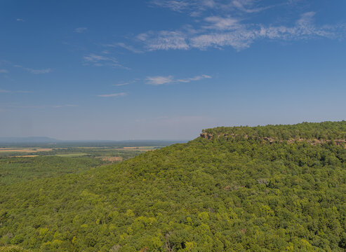 Limestone cliff and dense forest landscape in Petit Jean State Park