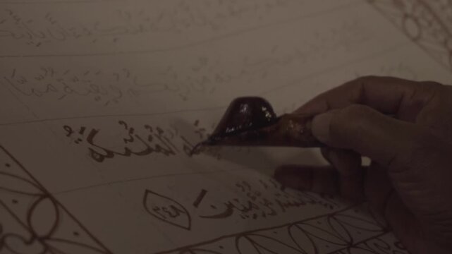 Calligrapher Crafting Arabic Calligraphy