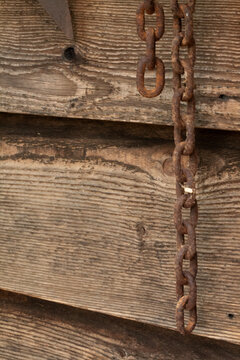 rusty chain wooden background