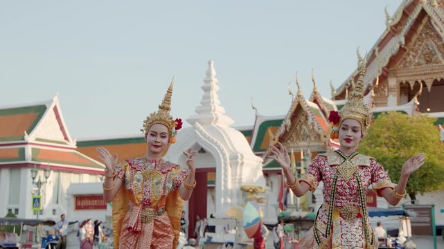 Thai Traditional Dancers Performing in Traditional Costumes Outside Temple