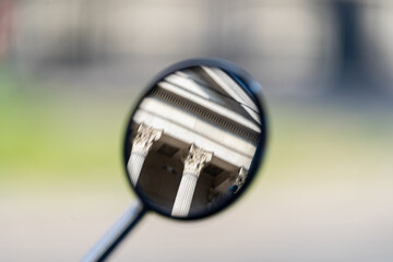 Mirror reflects. Building appears. Columns dominate. Architecture blurs. © VladyslavShcherbakov