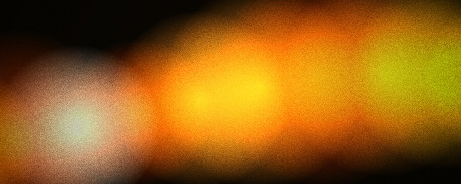 Abstract bokeh light background with warm orange and yellow glow, soft blurred lens flare on dark backdrop, grainy film texture for cinematic overlays and creative designs