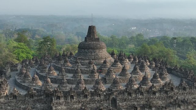 Aerial view of Borobudur Temple in Yogyakarta, Java, Indonesia at sunrise.