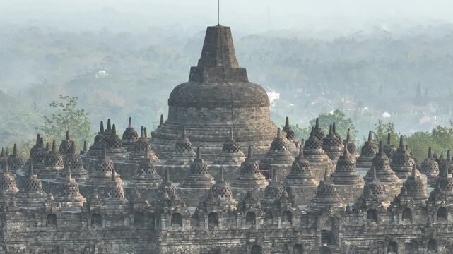 Aerial view of Borobudur Temple in Yogyakarta, Java, Indonesia at sunrise.