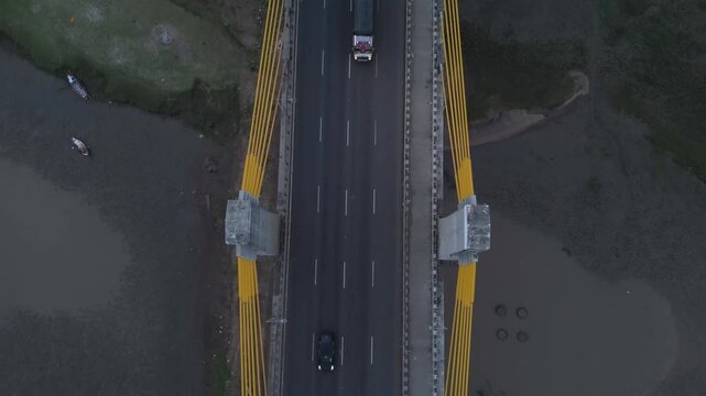 Top down aerial view of highway bridge with vehicles and modern transportation infrastructure in Bharuch Gujarat India