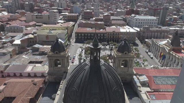 Tilt down aerial shot of the cathedral dome in La Paz, Bolivia