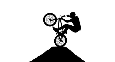 Fototapeta premium Silhouette of BMX rider performing a wheelie on a dirt ramp against a white background