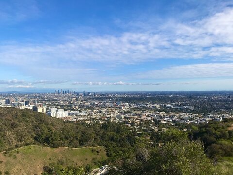 Los Angeles City Skyline From Hillside Overlooking Urban Sprawl And Coastal Horizon On Clear Day