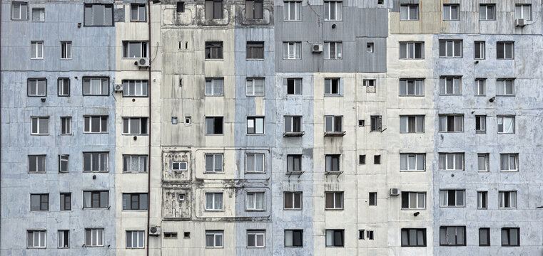 Urban apartment building facade with many windows