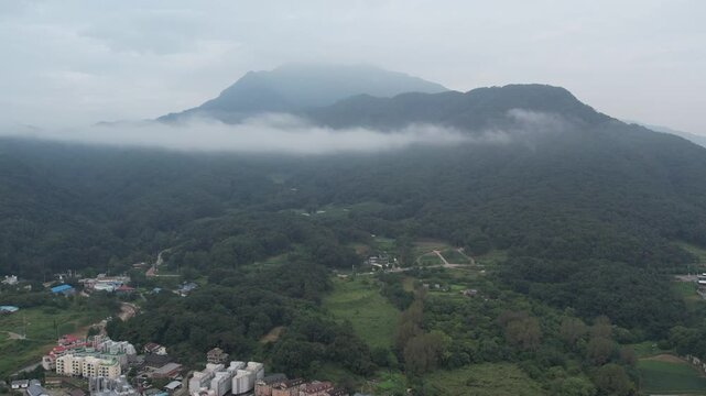 Mist and clouds wrapping around the mountains after the rain_01