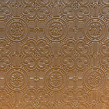 Textured brown Victorian wallpaper as seen in many old houses for use as a background texture