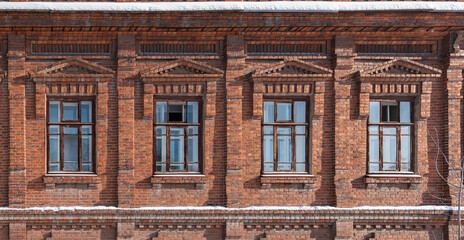 Four windows of the old mansion 19 century with brown bricks wall © Dmitrii Potashkin