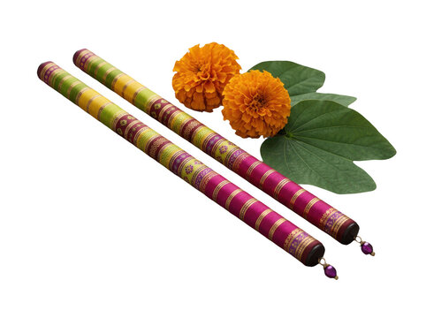Two decorative dandiya sticks with orange marigold flowers and green leaves for navratri festival celebration