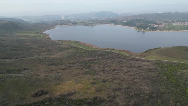 Bard Lake, or Wood Ranch Reservoir, a large reservoir on the border of Thousand Oaks and Simi Valley, California. Panning right, shot on an overcast afternoon in January 2024.