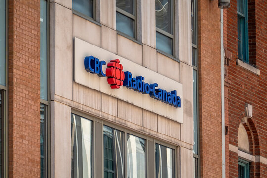 Ottawa, ON, Canada - Sept 13, 2026: Angle view of CBC Radio-Canada sign mounted on a brick building facade.