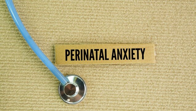 Stethoscope with the words Perinatal anxiety. mental health condition that involves intense, uncontrollable worry and physical tension during pregnancy or up to one year after birth