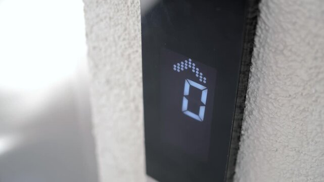 Elevator display shows zero as it approaches the ground floor