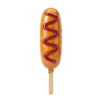 Golden corn dog on a stick with red ketchup drizzle