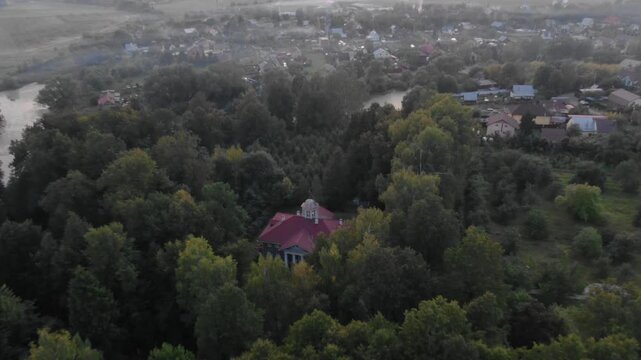 Drone flies forward and tilts down to the manor in Zvenigorod