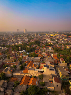 Jakarta cityscape at sunset featuring urban residential area