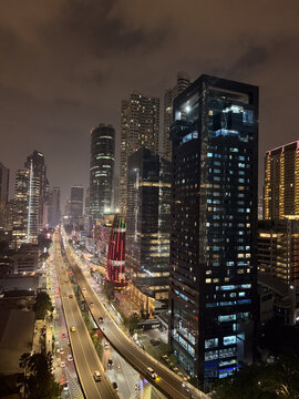 Jakarta city skyline night with highway traffic