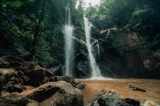 Majestic Multi-Tiered Waterfall in Tropical Rainforest