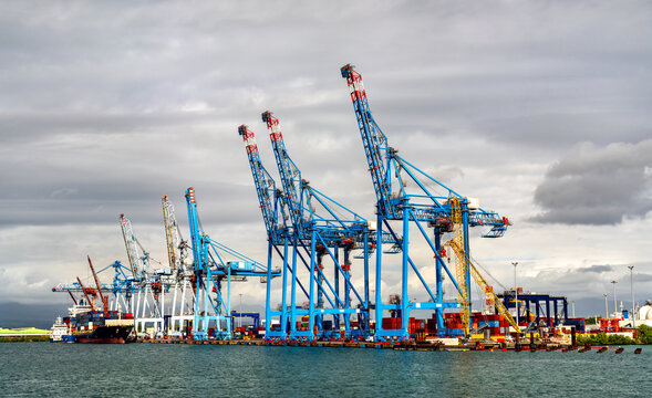 Cargo cranes and container terminal infrastructure at the Port of Pointe-a-Pitre along the waterfront in Guadeloupe, Caribbean France