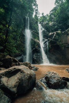 Majestic Multi-Tiered Waterfall in Tropical Rainforest