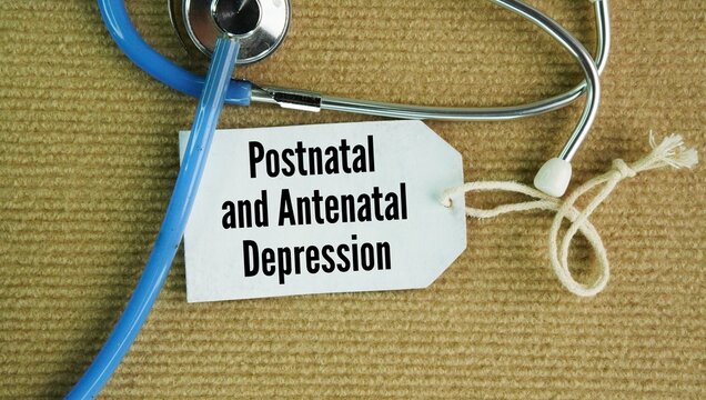 Stethoscope and paper tag with the words Postnatal and antenatal depression. serious mental health conditions that happen during pregnancy or after childbirth.