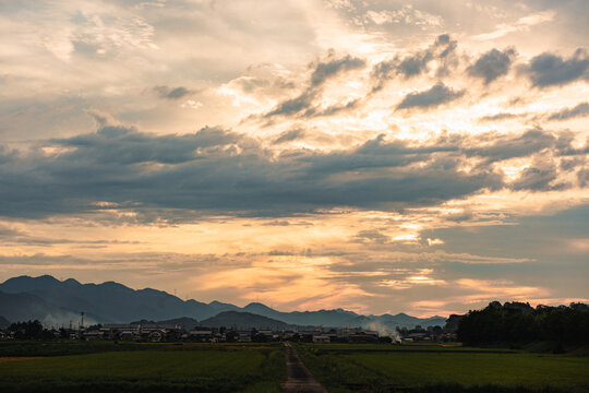 Rural sunset sky above distant mountains in Japan