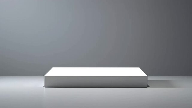 White rectangular block on shiny gray surface, 4K video

