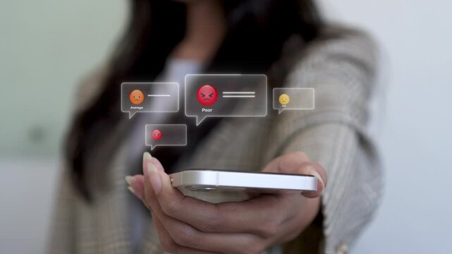 Close up of Businesswoman holding smart phone and Digital Costumer Review bubbles populating