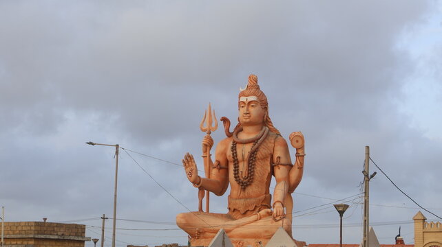 Giant Lord Shiva Statue Meditating, Holding Trishul and Damru, Symbol of Power and Destruction in Hinduism