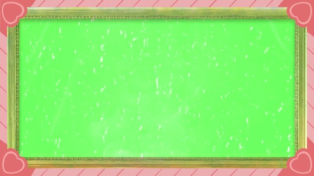 Chroma screen featuring a bright green display bordered by a decorative golden frame adorned with pink corner accents showcasing romantic heart symbols throughout the composition.