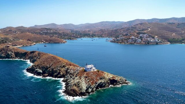Establishing aerial view of Kea - Tzia island, Cyclades, Greece, with the lighthouse and bay of Korissia and Vourkari