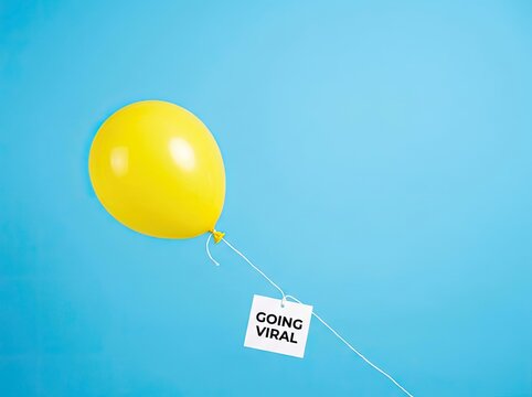 Yellow balloon carrying a Going Viral tag perfect for social media marketing campaigns symbolizing rapid online popularity and trend success