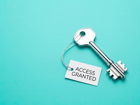 Silver key with access granted tag on teal background ideal for cybersecurity content symbolizing authorized security permission and trust