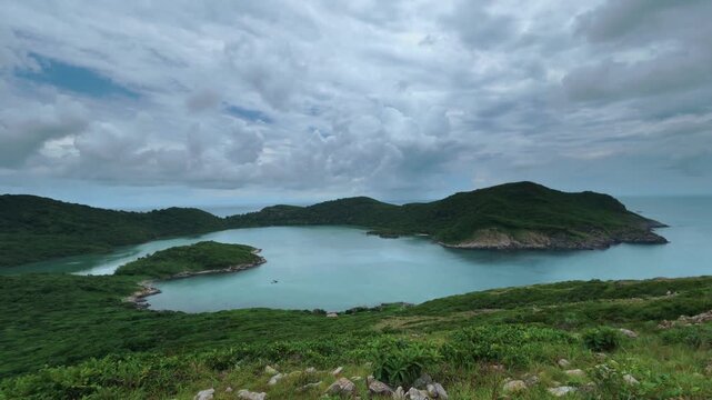 Timelapse of drifting clouds over the tropical Dam Tre lagoon on Con Son island in Con Dao archipelago, Vietnam