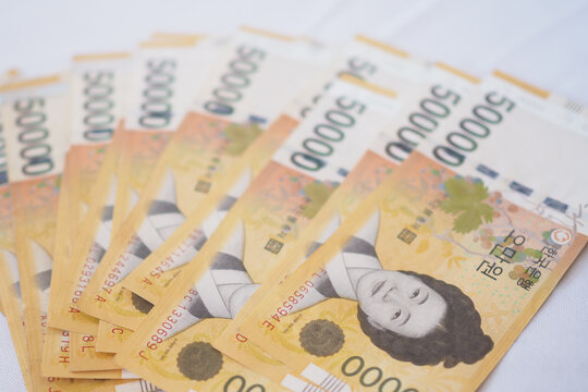 The currency of Korea which is used to represent value in exchange and the won is the main currency of Korean people. Korean won notes for money concept background.