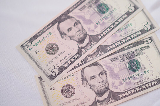 USD currency , Many dollar bank notes Placed on the table.The  Dollar is the currency of USA that is used to change, buy, sell, accumulate, and invest in united kingdom's state people.