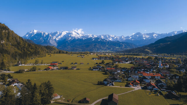Mountain church and village in green valley