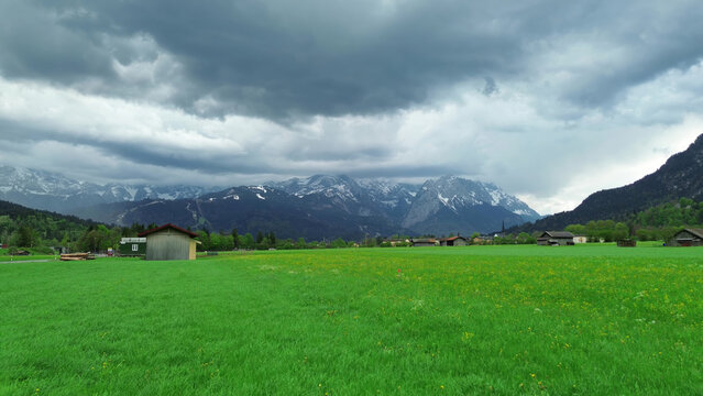 Colorful alpine village under cloudy sky