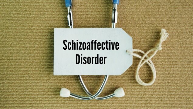 Stethoscope and paper tag with the word Schizoaffective disorder. chronic mental health condition marked by a combination of psychotic symptoms, such as hallucinations or delusions, and mood disorder