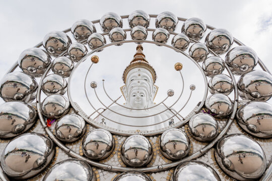 Five large and beautiful white Buddha statues arranged in a tiered formation at Wat Pha Sorn Kaew Temple in Phetchabun Province, Thailand.