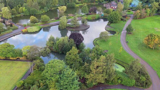 Aerial video of Alexandra Park Boating Lake and Bowling Green in Oldham