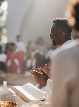 Nigerian man in a church pew looking toward a reader with a blank open book, natural and attentive for parish and religious themes