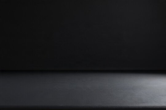 Dark background with a smooth graphite grey surface and soft light falloff, providing a clean matte texture for product mockup and copy space
