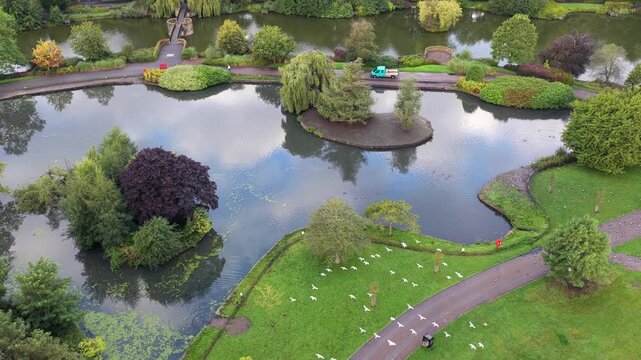 Aerial video of Alexandra Park Boating Lake Islands and Promenades in Oldham, Greater Manchester. 
